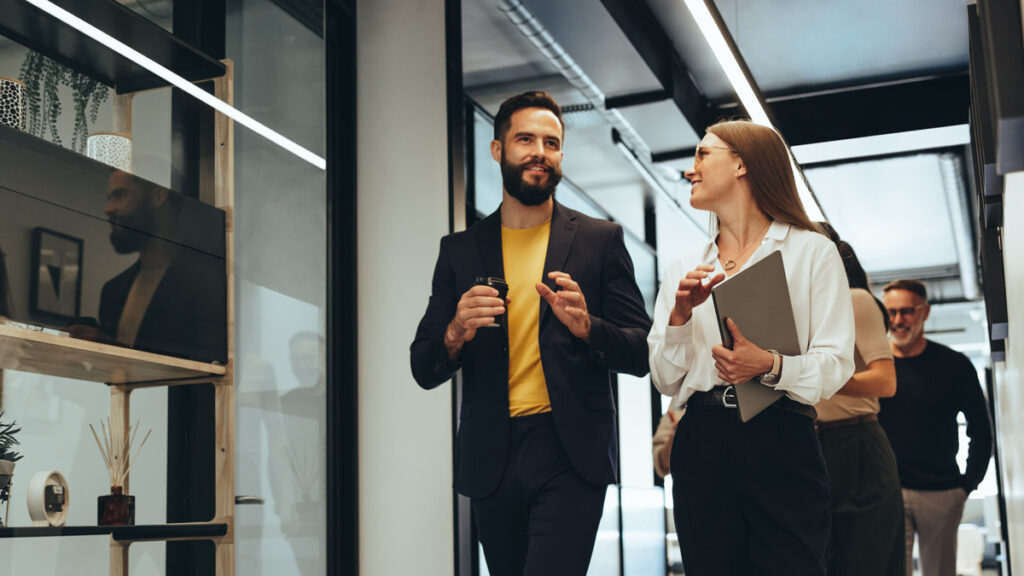 Young professionals having a discussion in a modern office.