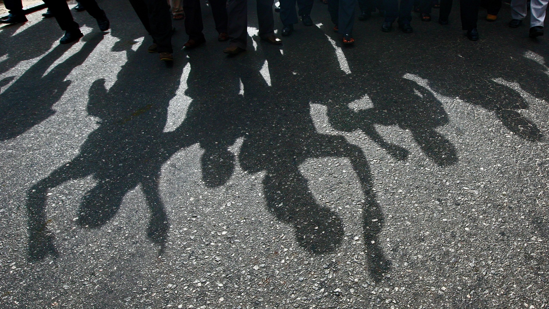 Shadows of people at a protest